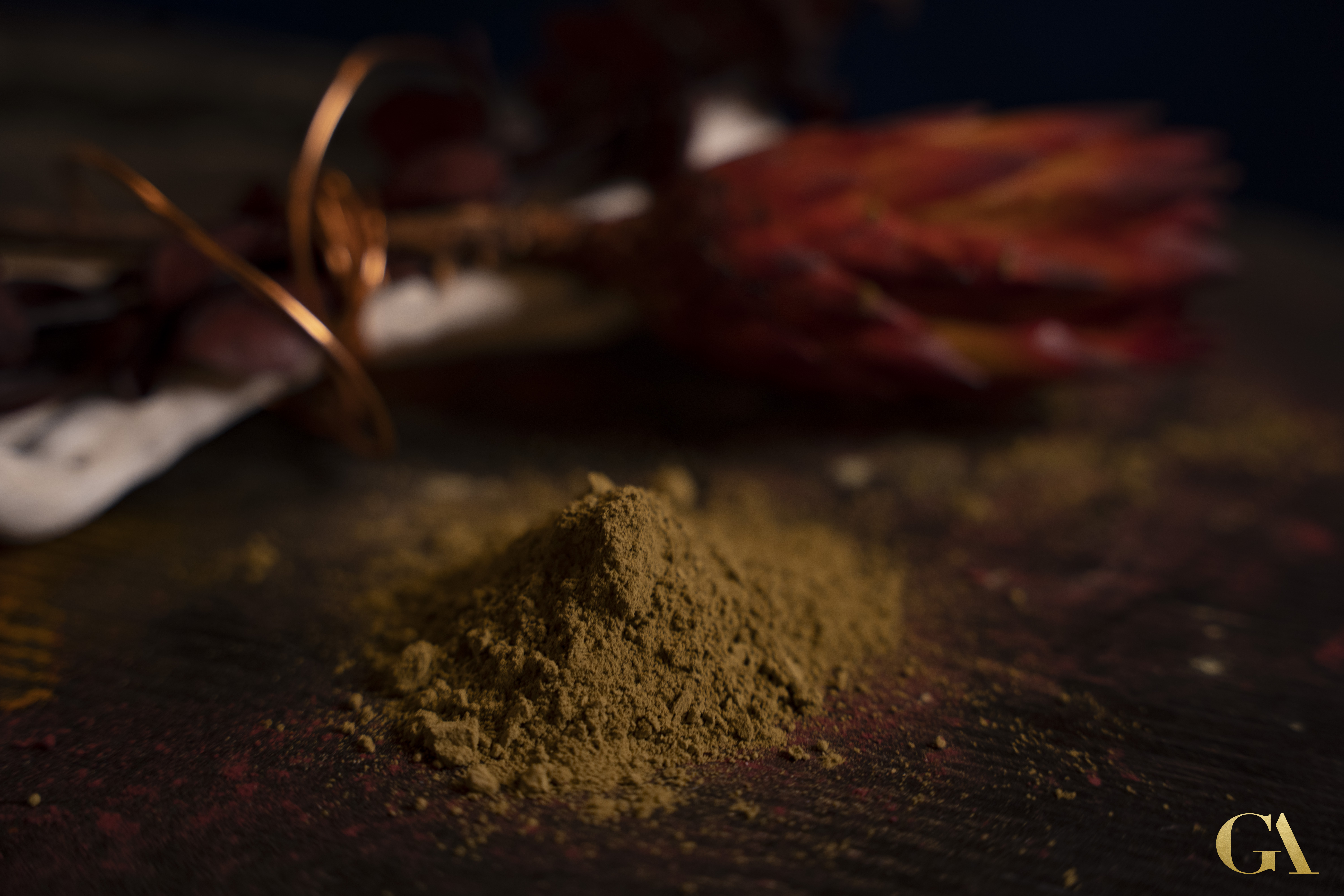 Natural henna powder preparation with traditional tools for organic hair coloring at GA Salons